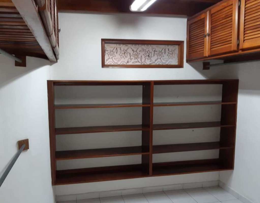 Elegant entry foyer with marble floor, wooden trim, curved staircase PH Torres de Toscana Panama