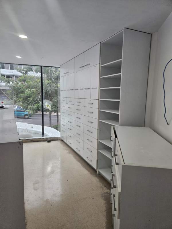 Large bright commercial space with built-in shelving and large windows Unicentro Bella Vista Panama