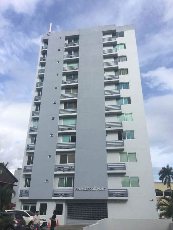 Living dining area with sectional sofa access to balcony PH Albrook Point Clayton Panama