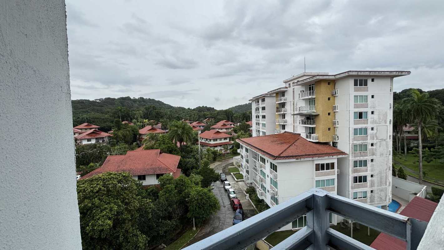 Apartment complex with red roof balconies landscaped gardens Clayton Panama