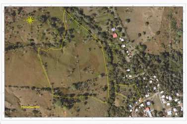 Aerial with marked property lines pasture land bordered by river Chorrera Panama
