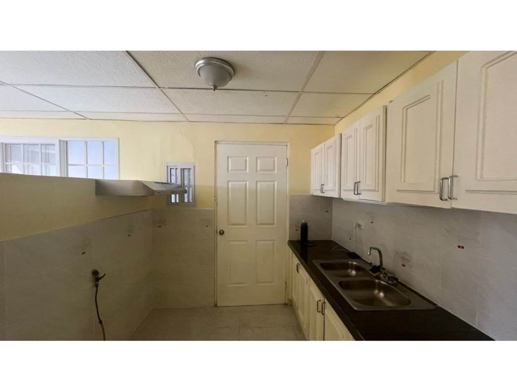 Traditional kitchen with white upper cabinets dual sink in Camino Real San Miguelito Panama