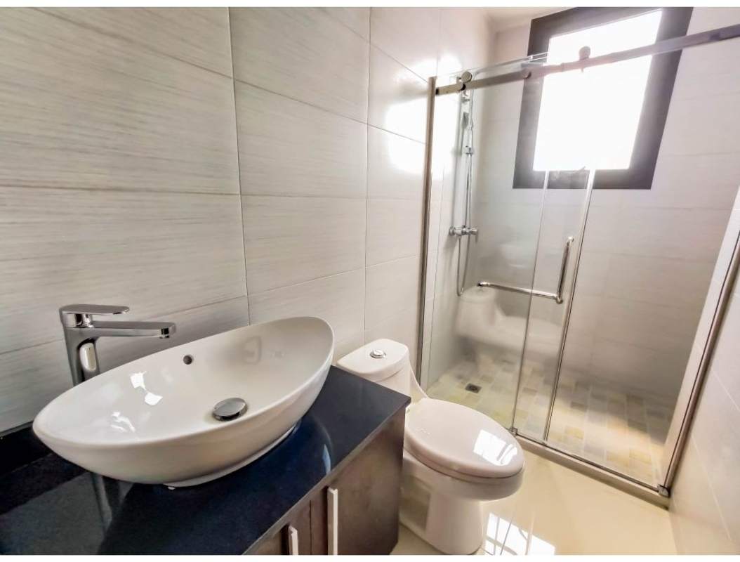 Aerial panorama of El Cangrejo with high-rises and greenery, Panama City