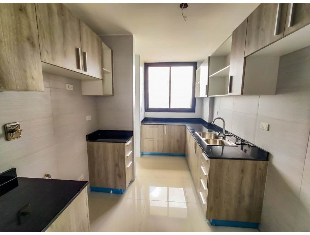 Kitchen with light wood cabinets, black granite countertops, stainless sink, PH Carreras El Cangrejo Panama