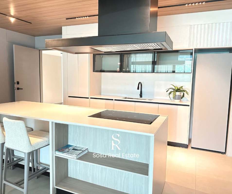 Shared social space and lounge with coworking facilities at Uptown Condo Suites Calle Uruguay