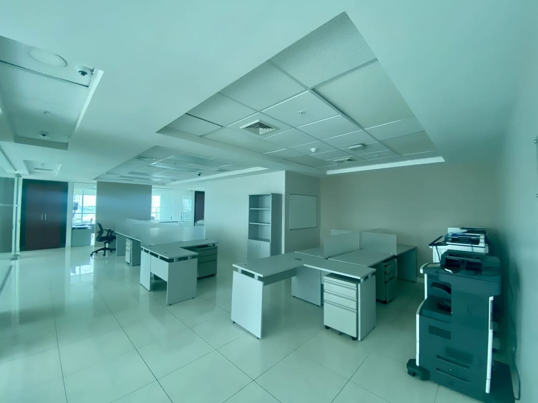 Corporate office with multiple cubicles glass dividers and bright natural light Bella Vista Corporate Tower Panama