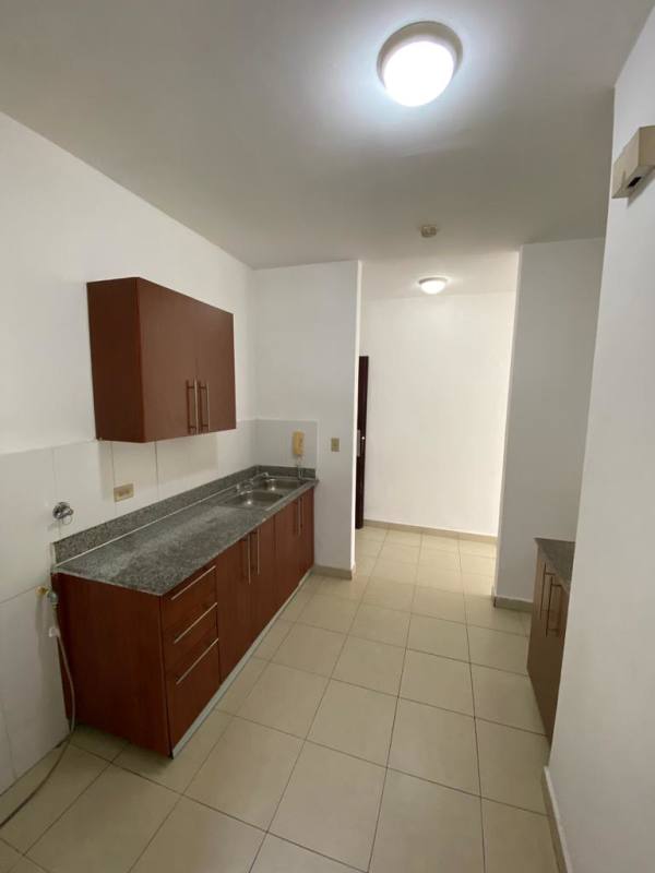 Galley kitchen with granite countertops storage cabinets PH Valentina El Ingenio Panama