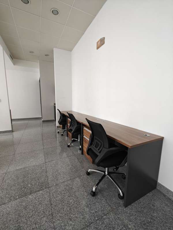 Minimalist commercial workspace with desks and office chairs PH Bella Vista Office Center Panama