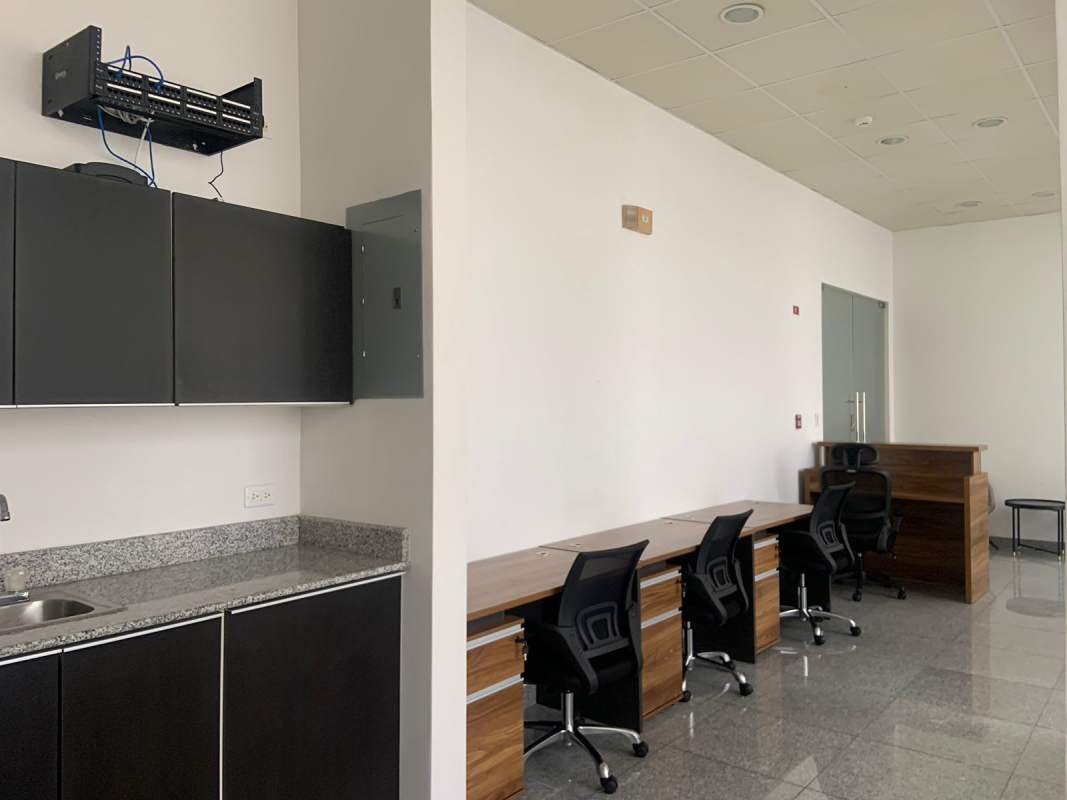 Office area with kitchenette, cabinets and network equipment in PH Bella Vista Office Center Panama