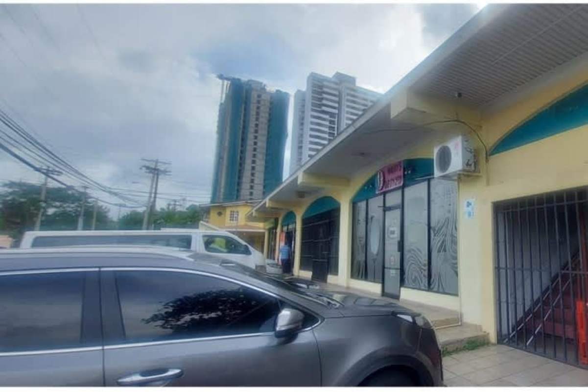 Exterior view of Condado Plaza mall with salon entrance storefront glass Condado del Rey Panama City