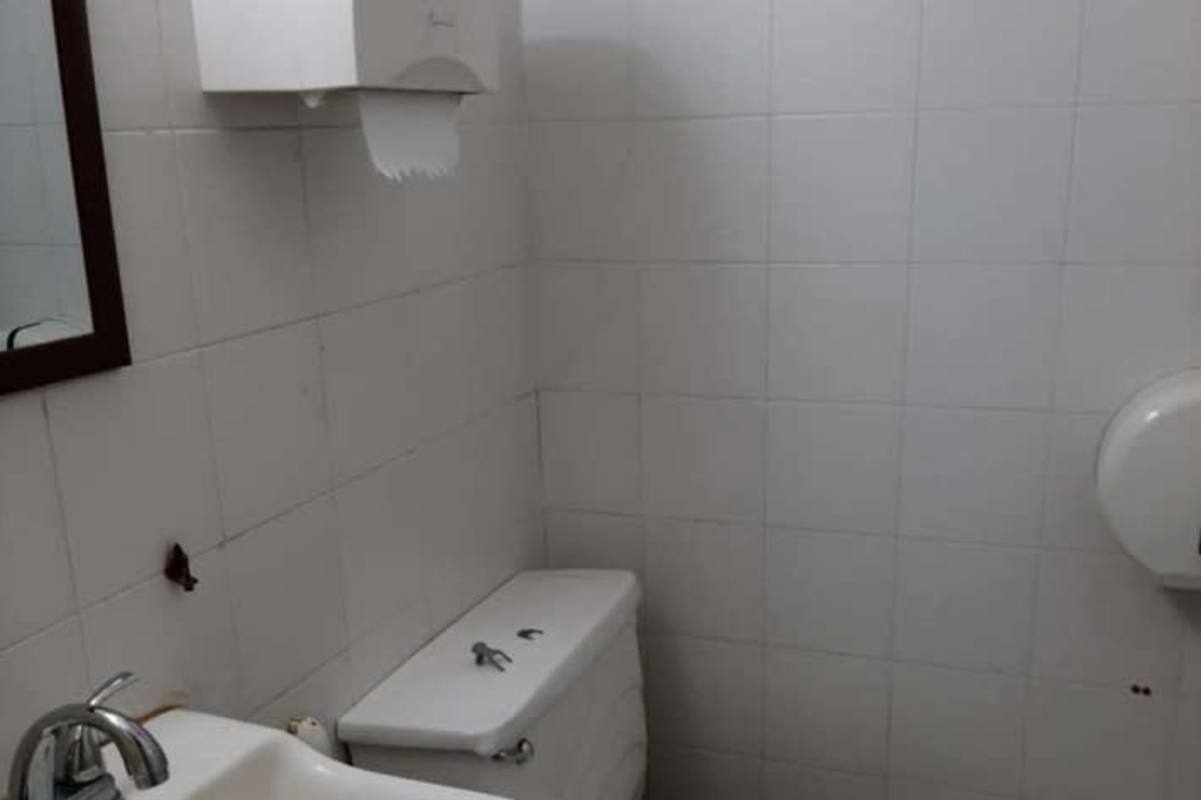 Modern kitchenette with sink, countertop, window city view PH Financial Park Obarrio Panama