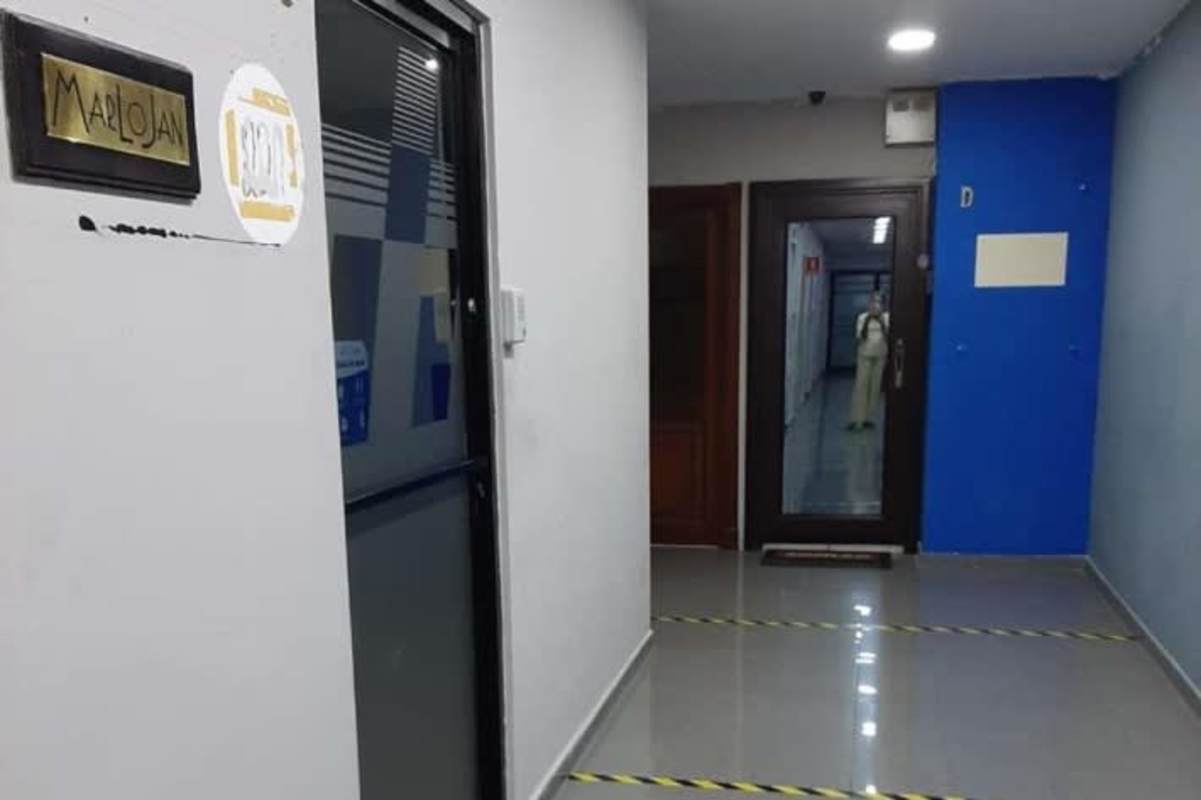 Commercial office hallway with signage and glass door in Obarrio Financial District Panama City
