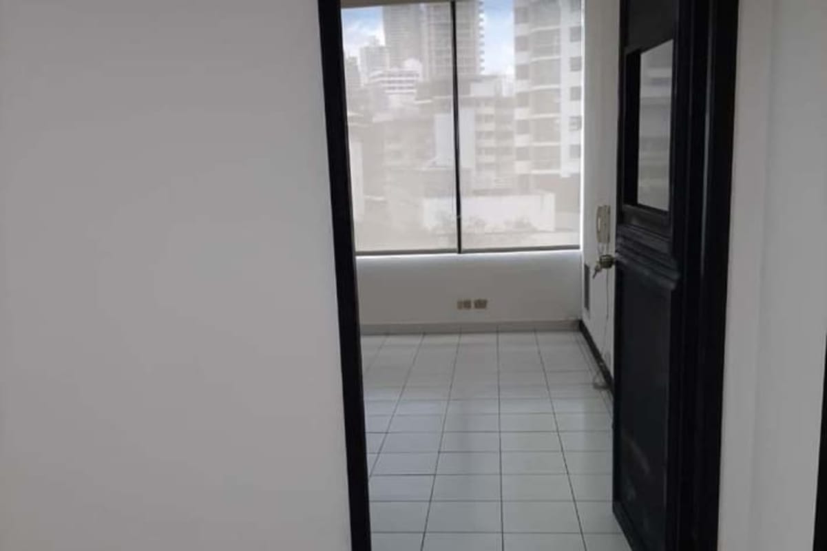 Open bright office space with large window, cityscape view and tiled floors in PH Financial Park Panama City