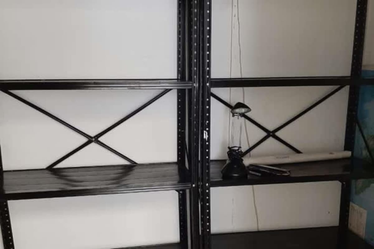 Storage space with industrial shelving inside commercial office building PH Financial Park