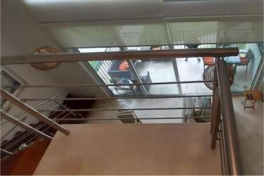 Modern open living area with loft and large windows in PH Puntarena beachfront apartment Coclé Panama