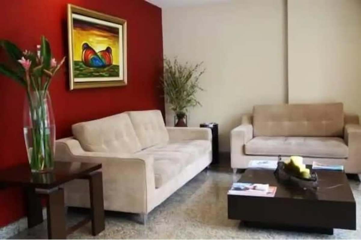 Furnished hotel guest suite with kitchenette, sofa, work desk located in El Cangrejo Panama City
