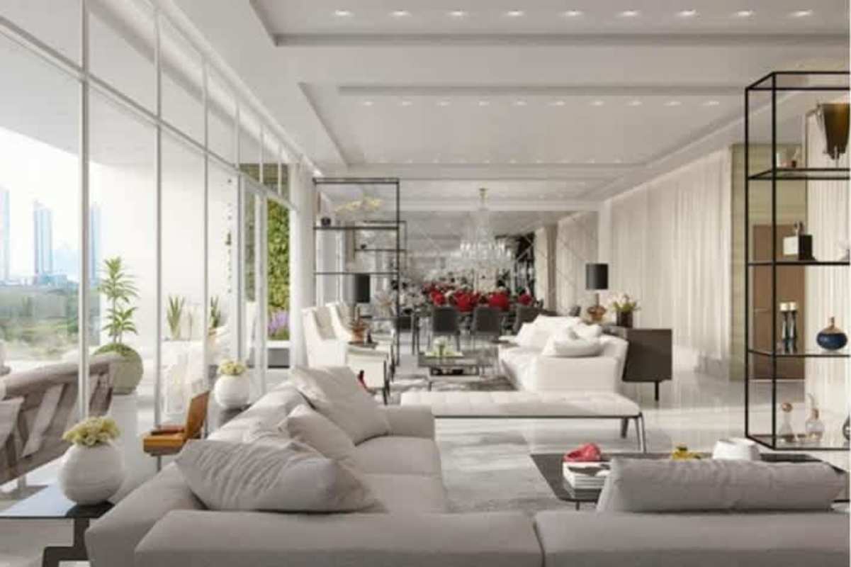 Modern open concept living room with panoramic windows and golf views in Empire Residences Santa María Panama
