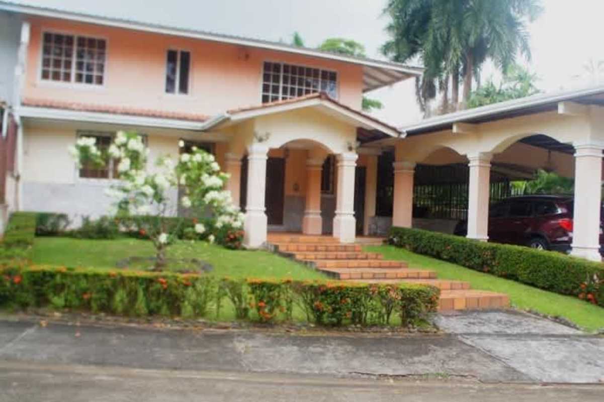 Spacious living room with marble flooring, leather sofas, and treadmill in Los Rios Corozal Panama