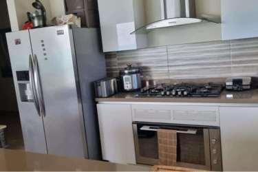 Modern kitchen with granite countertops and stainless steel appliances Playa Caracol