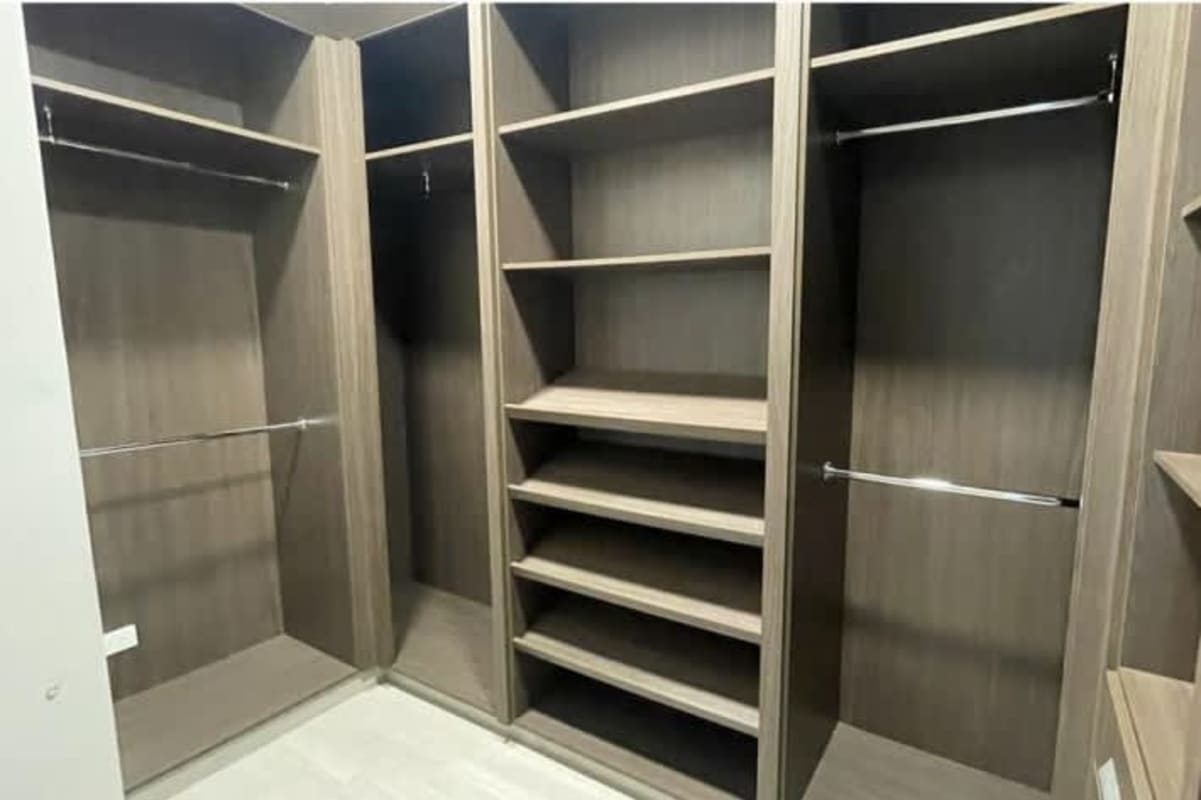 Luxury bathroom with marble walls, double sink vanity, frameless glass shower, PH Regalia