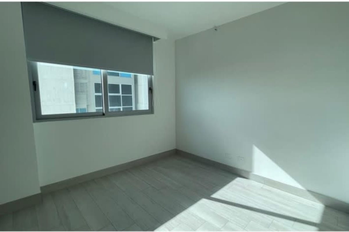 Empty bedroom with floor to ceiling windows and city/ocean view at PH Regalia Costa del Este