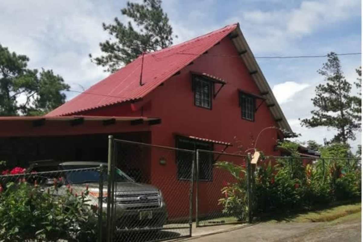 Farmhouse kitchen with white cabinets, decorative tile backsplash, appliances at Altos de Cerro Azul Panama