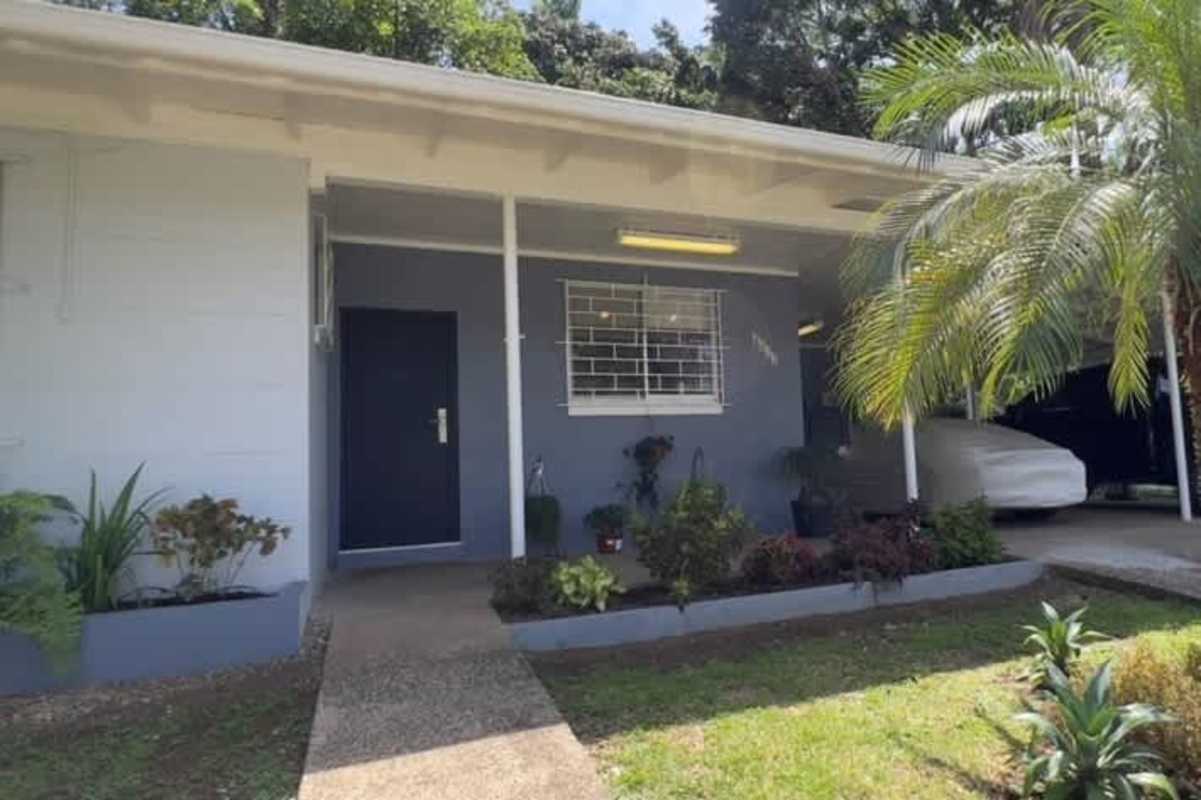 Spacious backyard with mature trees and lawn at Albrook Ancón house Panama City