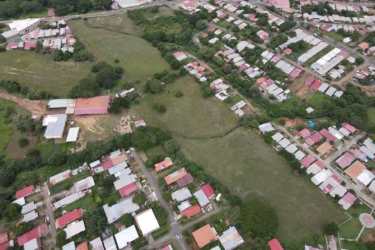 Aerial of suburban neighborhood and large developable land parcel Panama