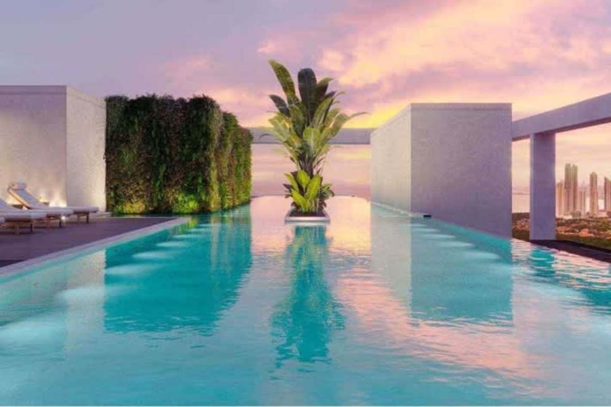 Children's playground with colorful structures and green rooftop at The Ivy Santa Maria Panama