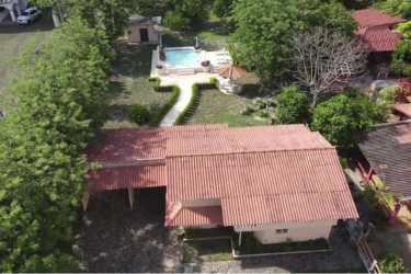 Aerial of Malibu Beach community homes with swimming pools near ocean Nueva Gorgona Panama