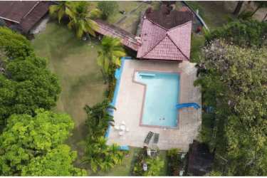 Luxury beachfront mansion swimming pool with tropical gardens and Pacific Ocean views in Costa Esmeralda Panama