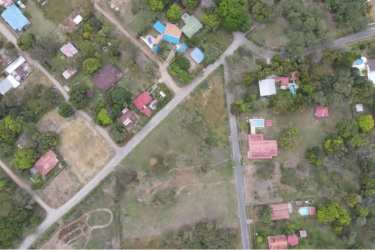 Aerial view of neighborhood with scattered homes, lots greenery near Pacific beach Gorgona