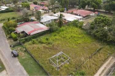 Flat residential lot fenced with metal frame close to Coronado amenities Panama