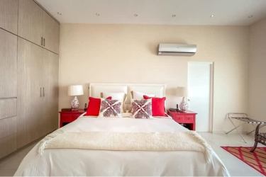 Open kitchen with island, pendant lights, stainless appliances in Bijao Panama condo