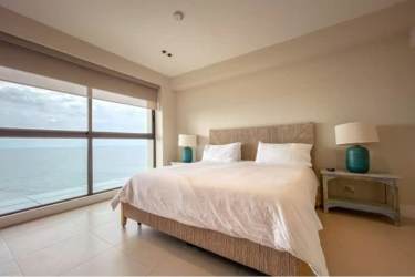 Spacious master bedroom with ocean views and terrace access Punta Caelo beachfront penthouse Panama