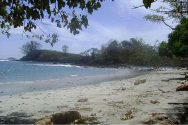Tropical coastal land with beach and rocky oceanfront on private island Panama