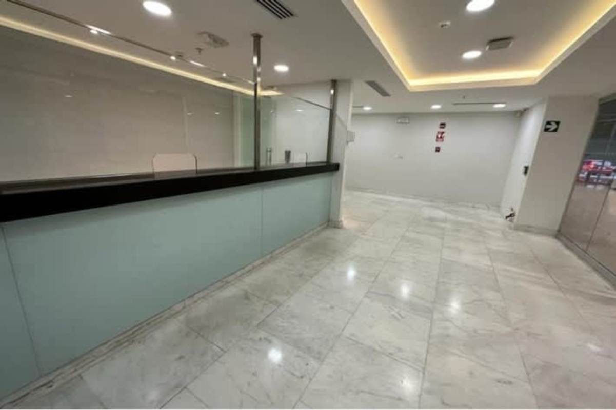 Open plan empty commercial space with tile floors and glass office walls Hi Point Offices