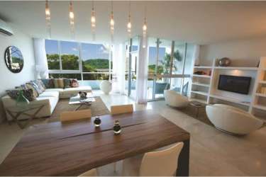 Modern living and dining area with panoramic windows ocean views at Casa Bonita Playa Bonita Panama
