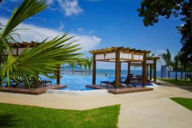 Spa room with massage tables and candle lighting in Pearl Club Casa Bonita Playa Bonita Panama