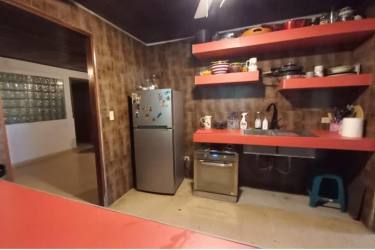 Covered porch of commercial house for sale with decorative grill windows David, Panama