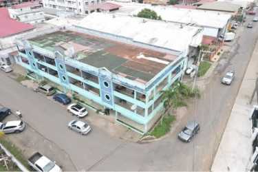 Three-story blue apartment building in Barrio Colón La Chorrera Panama