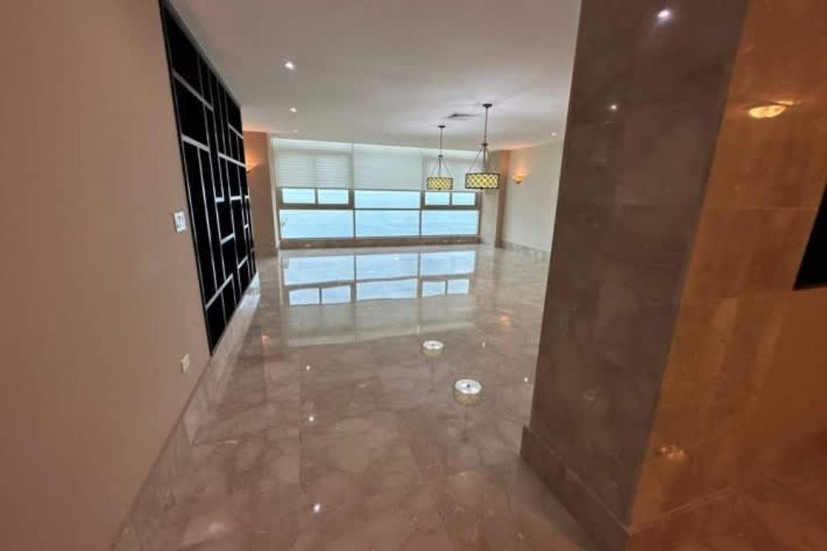 Large balcony overlooking Pacific Ocean and city skyline from Pacific Point Tower 200 apartment