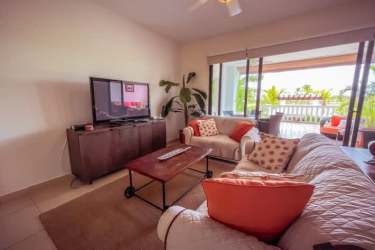 Bright living room with large windows ocean and golf views PH Islamar Vista Mar Panama