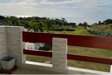 Balcony with wooden railing ocean and garden views San Carlos Panama