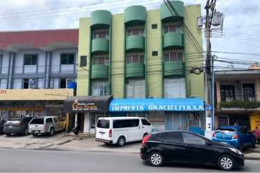 Reception lobby with glass partitions and mail slots in Hotel La Chorrera