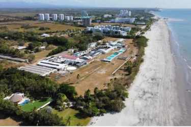 Aerial beachfront development with green landscaping, ocean access in Río Hato Panama