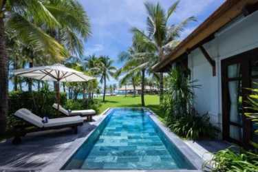 Aerial photo of beachfront development with resorts, residential areas, pools and sandy coastline in Río Hato Panama