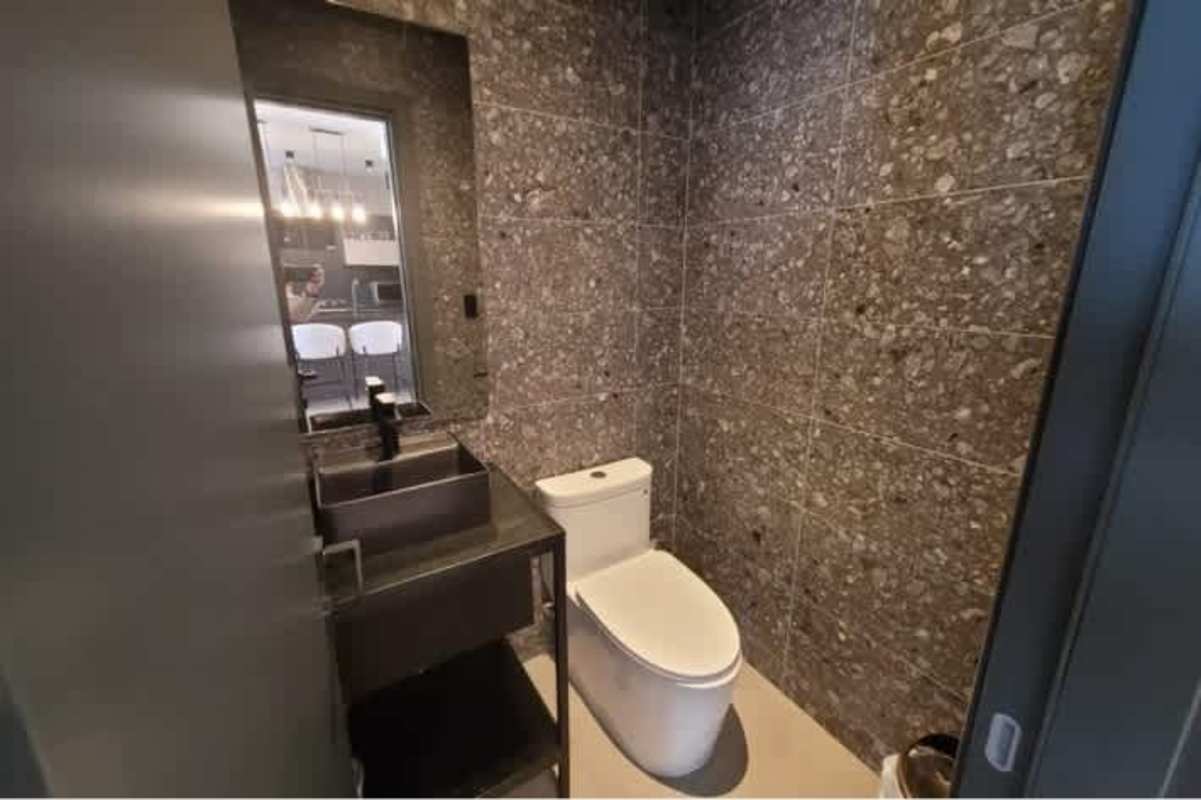 Contemporary kitchen with black granite countertop and sleek cabinets in PH Victory Sport Panama