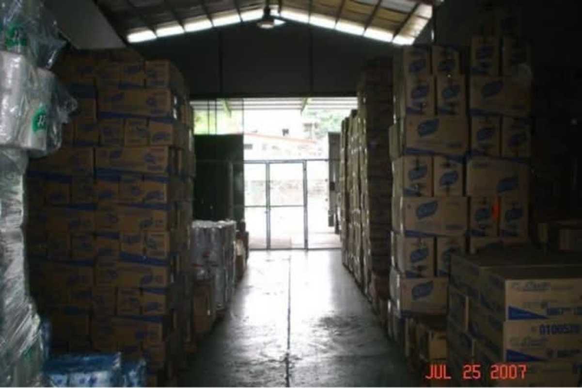 Interior warehouse view with stacked boxes pallets high ceiling Rio Abajo Panama warehouse for rent