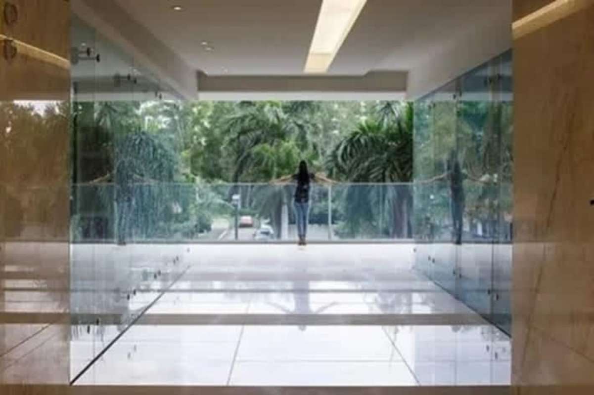 Multiple elevators and marble finishes in Boulevard del Este commercial tower elevator lobby Costa del Este Panama